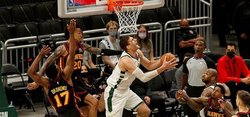 WITHOUT GIANNIS, BUCKS BEAT HAWKS 123-112 FOR 3-2 LEAD