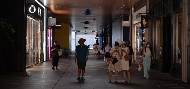 CHINESE CITY DIMS LIGHTS IN HEATWAVE POWER CRUNCH