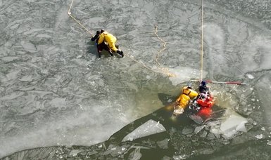 Missouri firefighters training on frozen lake rescue teens
