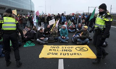 Climate activists block Amsterdam highway in protest against ING
