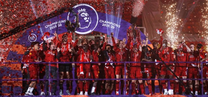 LIVERPOOL PLAYERS RECEIVE PREMIER LEAGUE TROPHY ON KOP