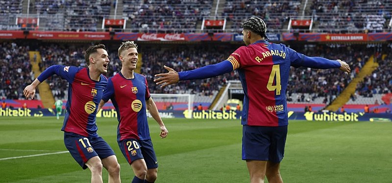 Barca thrash 10-man Real Sociedad to reclaim top spot