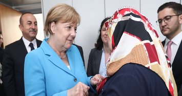 German Chancellor Merkel asks forgiveness for mistakes