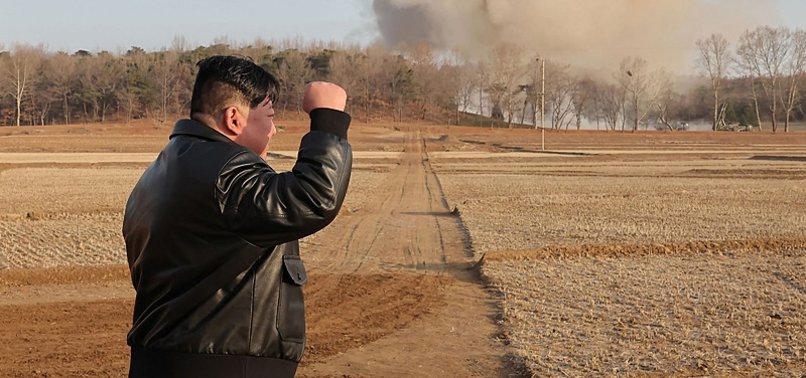 NORTH KOREAN LEADER WITNESSES FIRING DRILLS INVOLVING MASSIVE SUPER LARGE MULTIPLE ROCKET LAUNCHERS
