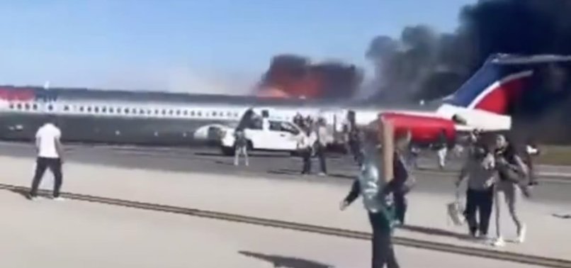 PASSENGER JET CATCHES FIRE WHILE LANDING AT MIAMI AIRPORT