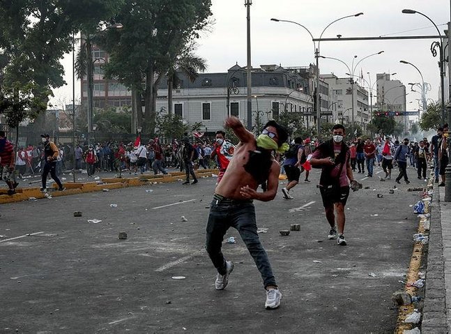 Thousands march on Peru's capital as unrest spreads, building set ablaze
