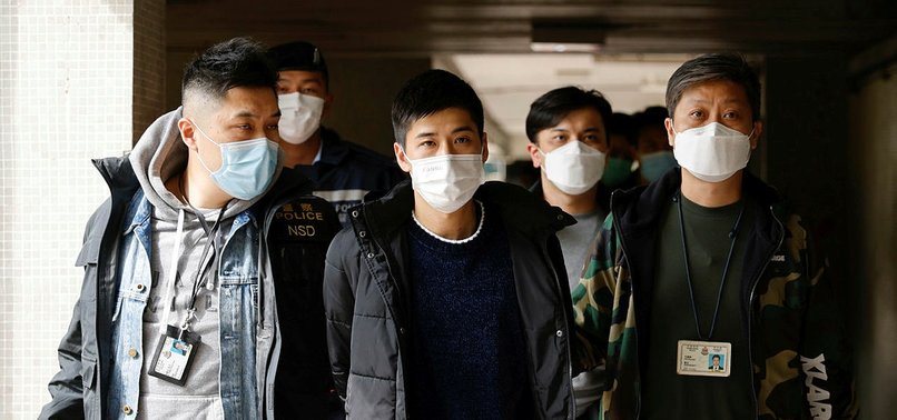 DOZENS OF HONG KONG DEMOCRACY ACTIVISTS ARRESTED UNDER SECURITY LAW AS CRACKDOWN INTENSIFIES