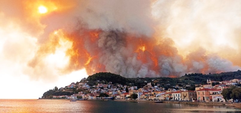 FLAMES SURROUND ISLAND MONASTERY AS FIRES RAGE IN GREECE