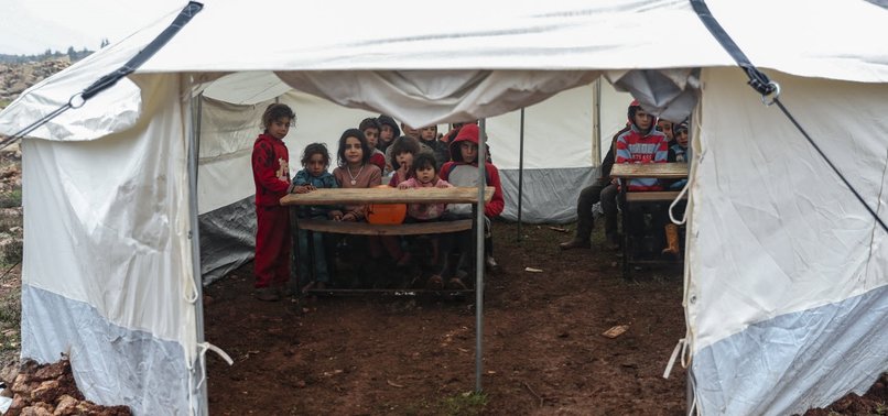 VOLUNTEERS TURN TENT INTO MAKESHIFT SCHOOL IN NW SYRIA