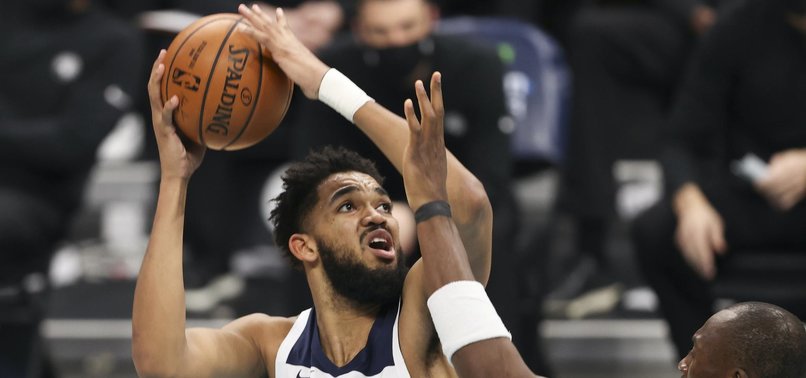 TOWNS, RUSSELL PUSH WOLVES TO 121-117 WIN AGAINST BULLS