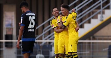 Sancho hat-trick against Paderborn keeps Dortmund in title hunt