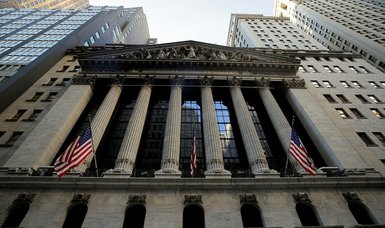 Wall Street rises, Nasdaq hits record high on recovery hopes