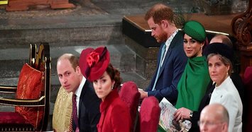 Prince Harry and wife Meghan wave royal goodbye