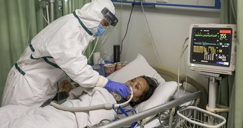 China's new virus cases fall again, deaths now exceed 1,100