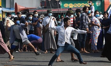 Pro-military marchers in Myanmar attack anti-coup protesters