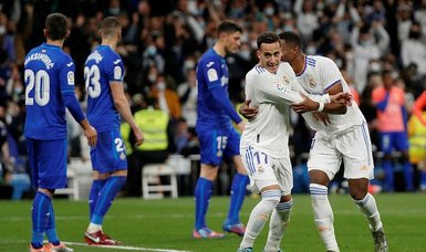Real Madrid stroll past Getafe to close on title