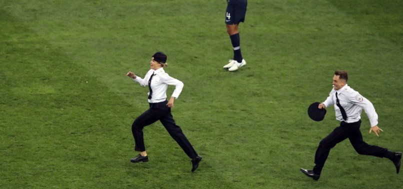 PUSSY RIOT CLAIMS PITCH INVASION AT WORLD CUP FINAL