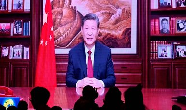 Xi says China 'will surely be reunified' in New Year's speech