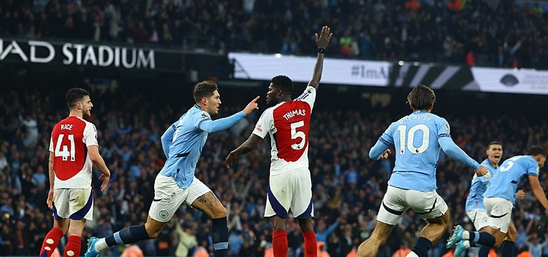Stones salvages Man City a draw against 10-man Arsenal