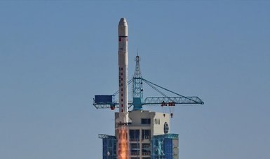 China launches 14 more satellites into space