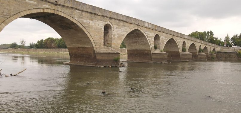 Historical bridge resurfaces amid water recession in citys river