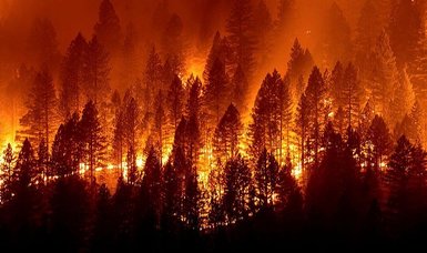 California fire threatens homes as blazes burn across West