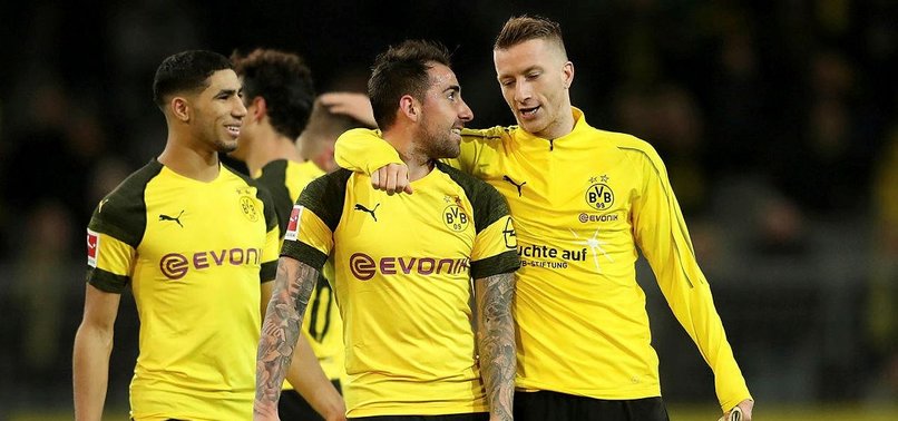 LEADERS DORTMUND MADE TO SWEAT FOR 2-0 WIN OVER FREIBURG