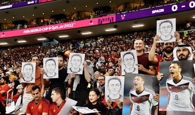 On Germany-Spain match, protests in the tribunes with Mesut Özil photos