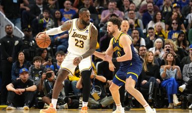 LeBron James' triple-double lifts Lakers over Warriors in 2OT