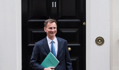UK's Hunt cuts budget deficit forecasts