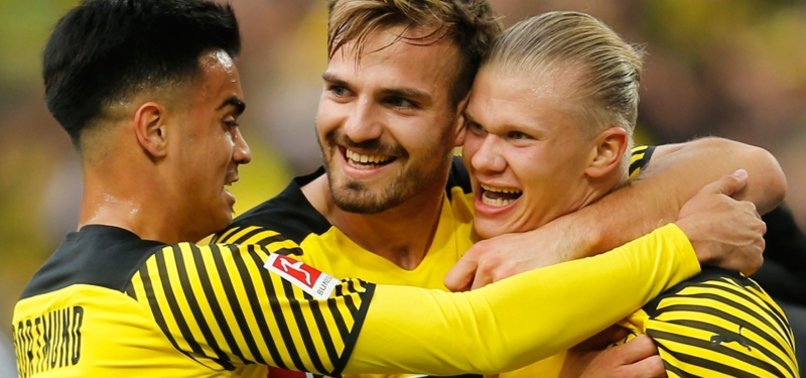 HAALAND RETURNS, SCORES 2 FOR DORTMUND TO GO TOP IN GERMANY