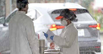 US coronavirus infections soar to near record in 24 hours