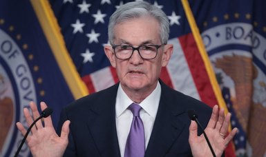 Fed chair says lowering rates 'begins to come into view'