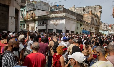 Thousands of Cuban demonstrators take part in Havana protest against shortages and rising prices