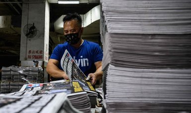 Pro-democracy Hong Kong tabloid Apple Daily may shut down this week