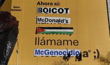 Pro-Palestine activists paint McDonald’s billboard in Madrid as ‘McGenocide’