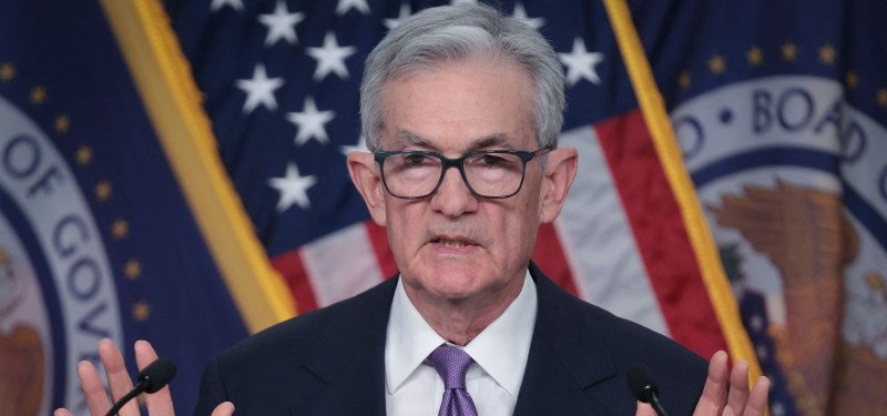Fed chair says lowering rates 'begins to come into view'