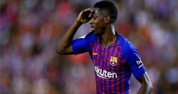 Barcelona's Dembele out with badly torn hamstring