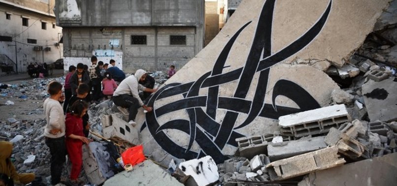 PALESTINIAN GRAFFITI ARTIST BILAL KHALID SHOWS PAIN OF GAZANS ON WALLS OF DESTROYED BUILDINGS
