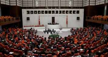 Turkish parliament strips status of three opposition MPs