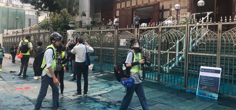 HONG KONG POLICE FIRE WATER CANNON WITH BLUE DYE AT MOSQUE