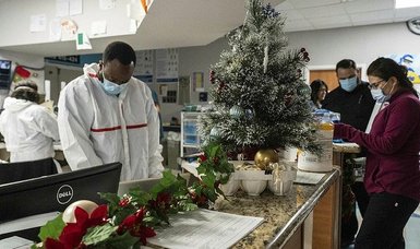 Americans celebrate Christmas Eve under spiraling COVID pandemic