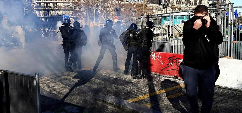 FRENCH POLICE FIRE TEAR GAS ON PROTESTERS ON PARIS CHAMPS ELYSEES