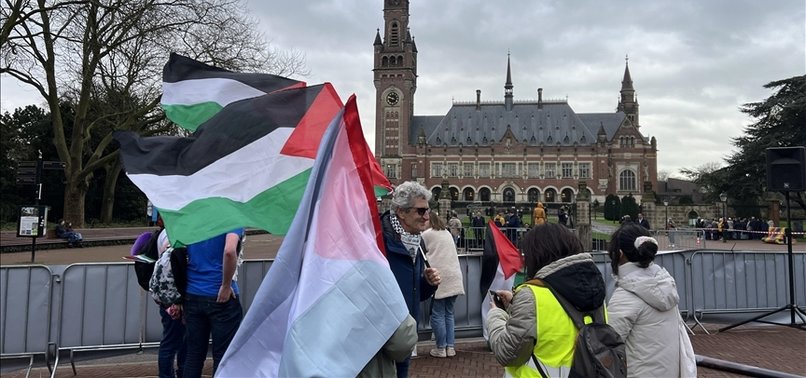 PROTESTERS BURN ISRAELI FLAG IN FRONT OF ICJ