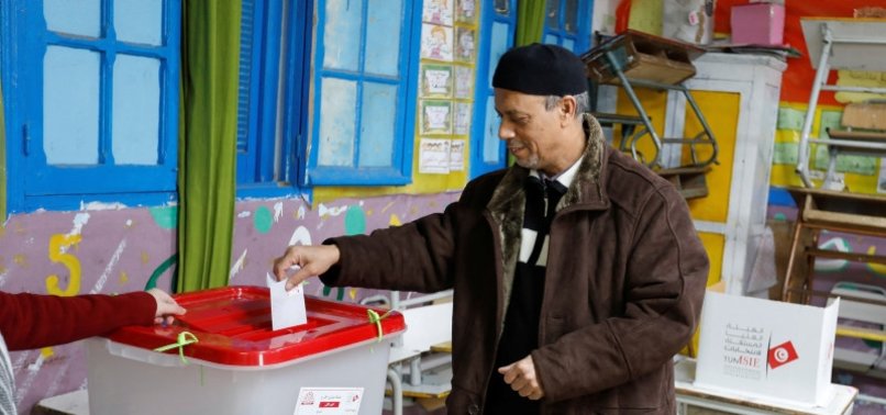 POLLS OPEN IN TUNISIAN ELECTION WITH TURNOUT UNDER SCRUTINY