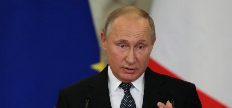 PUTIN WARNS NEW ARMS RACE IF US EXITS MISSILE TREATY