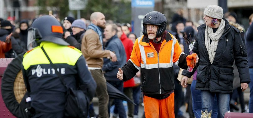 POLICE DETAIN 100 IN AMSTERDAM AFTER PROTEST OVER LOCKDOWN, CURFEW