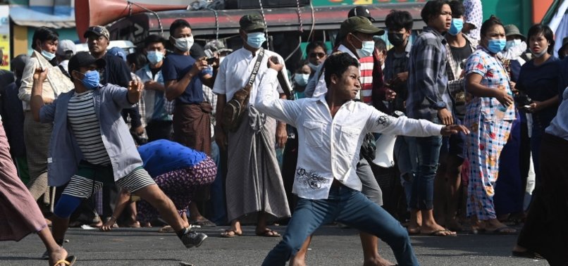 PRO-MILITARY MARCHERS IN MYANMAR ATTACK ANTI-COUP PROTESTERS