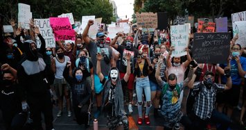 Protests over police killings rage in dozens of US cities