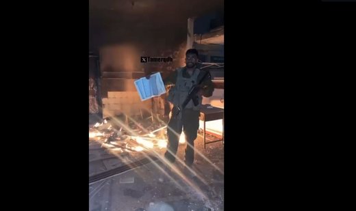 Israeli soldier throws a copy of Muslim holy book Quran into fire in Gaza